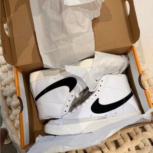 Nike women’s White and Black High-Top Sneakers